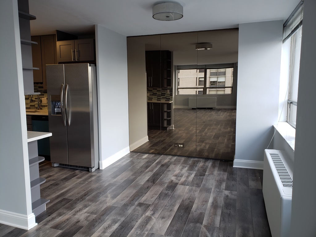 5701 North Sheridan Road, Unit 12L Chicago, IL 60660 - Photo 19 of 42 a view of a kitchen from the hallway