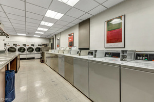 5701 North Sheridan Road, Unit 12L Chicago, IL 60660 - Photo 37 of 42 a large white kitchen with a large window