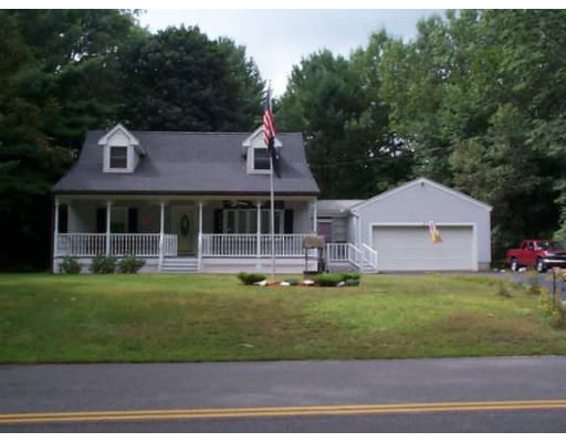 126 Greenwich Road Ware, MA 01082 - Photo 1 of 4 a front view of a house with a garden and trees