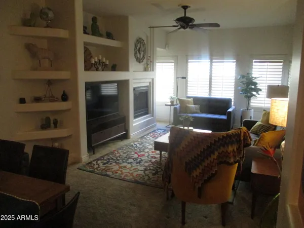 a living room with furniture and a fireplace