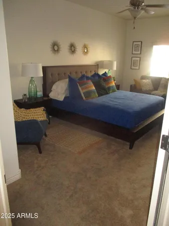 a bedroom with a bed and window