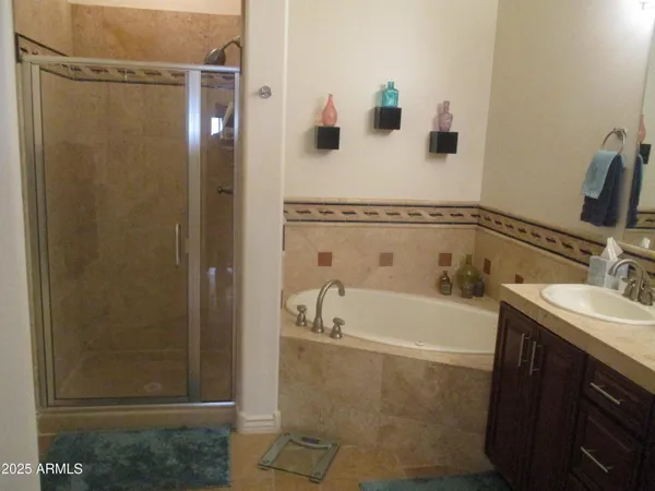 a bathroom with a tub and sink