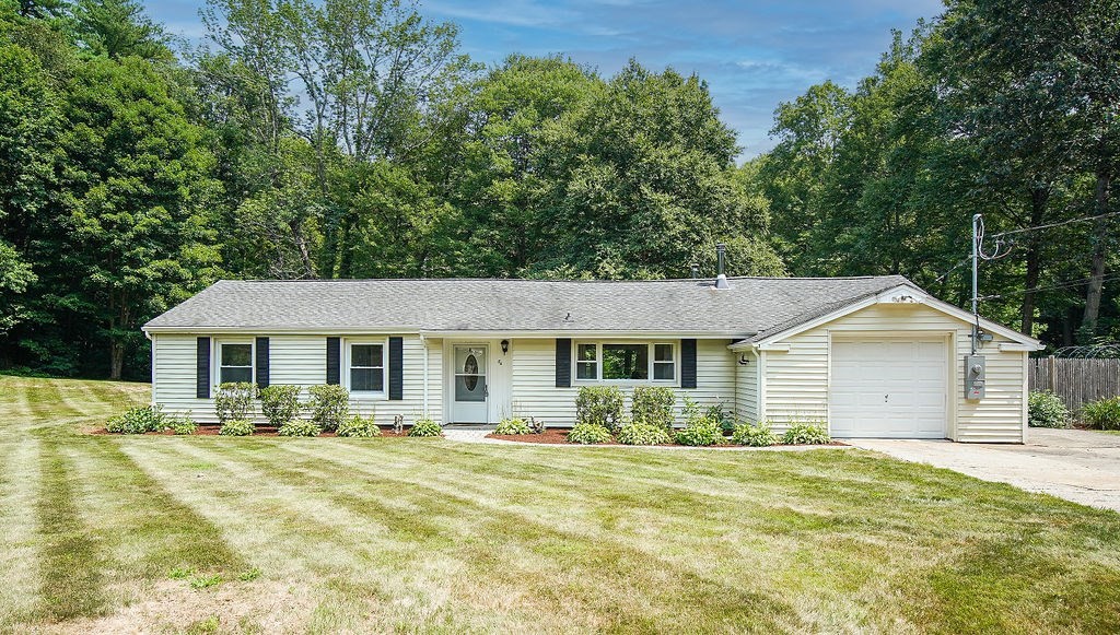 84 Clark Road Sturbridge, MA 01518 - Photo 1 of 30 a front view of a house with a yard