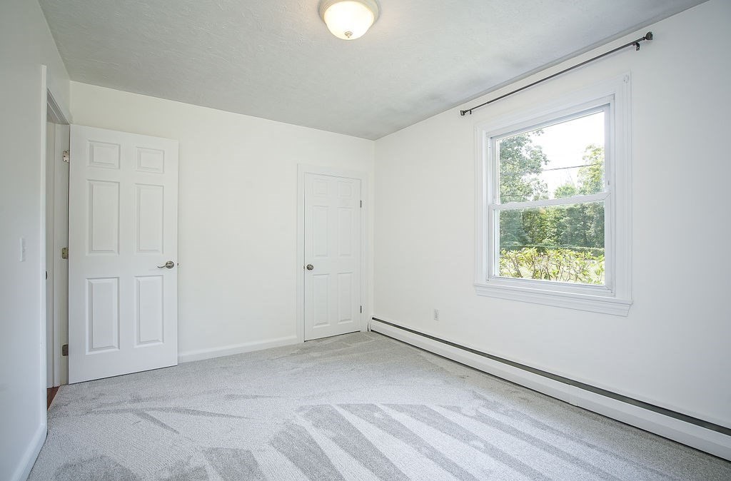 84 Clark Road Sturbridge, MA 01518 - Photo 19 of 30 a view of an empty room with a window