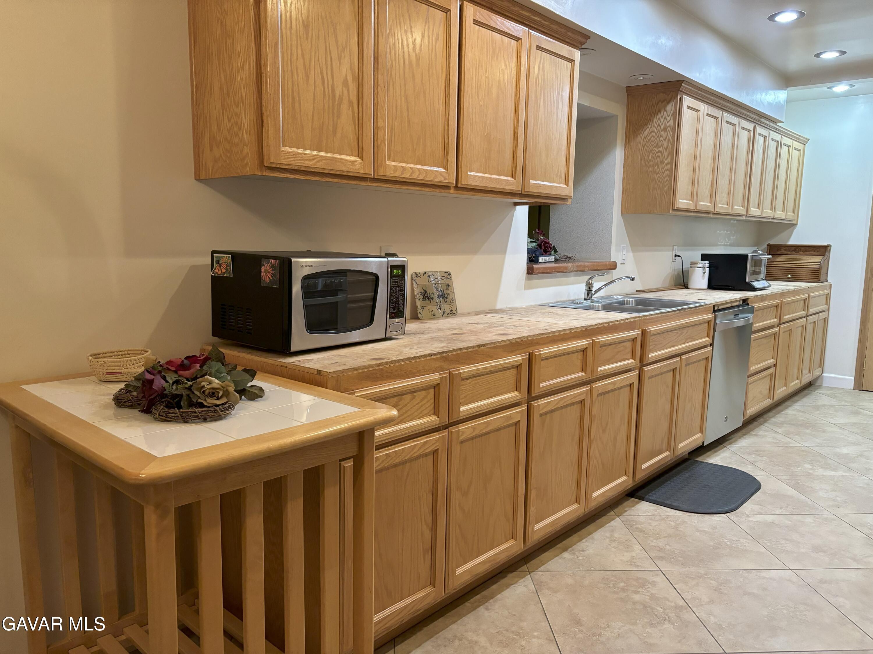 42930 Lake Hughes Road Lake Hughes, CA 93532 - Photo 17 of 38 a kitchen with a sink and cabinets