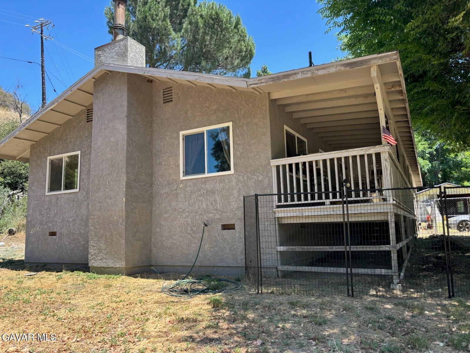42930 Lake Hughes Road Lake Hughes, CA 93532 - Photo 27 of 38 a front view of a house with a yard