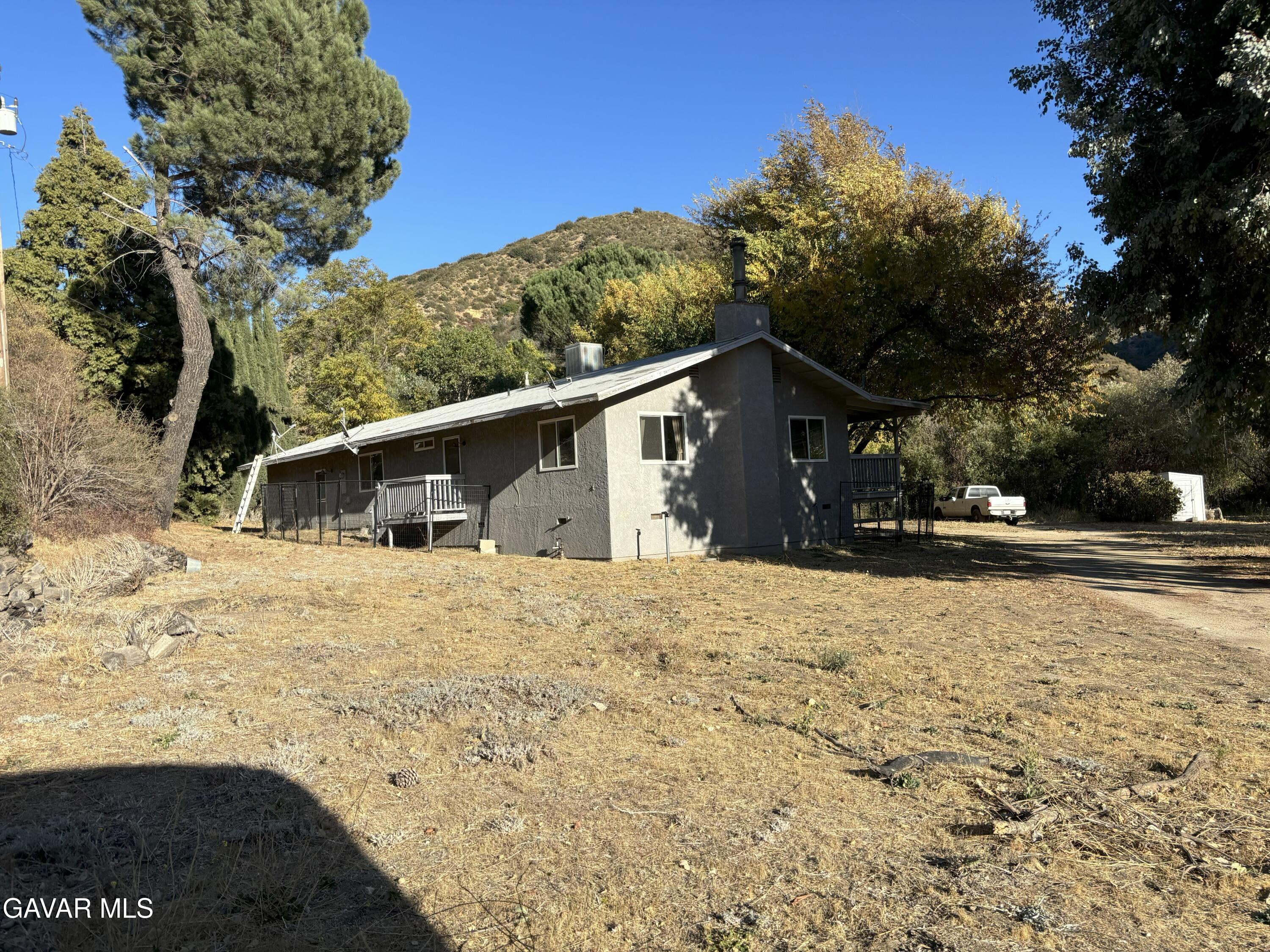 42930 Lake Hughes Road Lake Hughes, CA 93532 - Photo 32 of 38 a view of a house with a yard