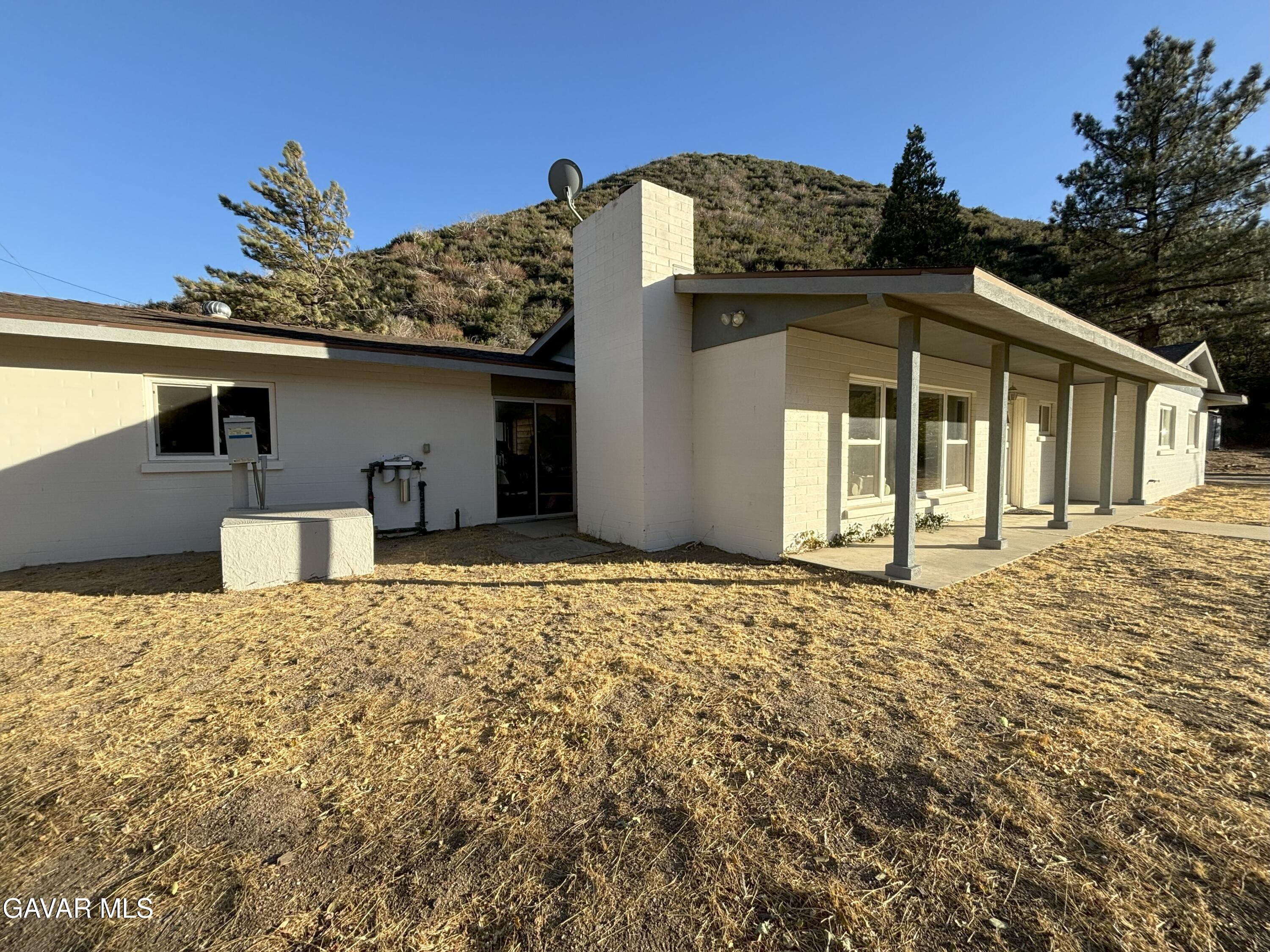 42930 Lake Hughes Road Lake Hughes, CA 93532 - Photo 6 of 38 a front view of a house with a yard