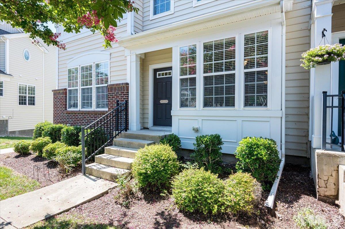 160 Grey Elm Trail Durham, NC 27713 - Photo 2 of 25 a front view of a house with a garden