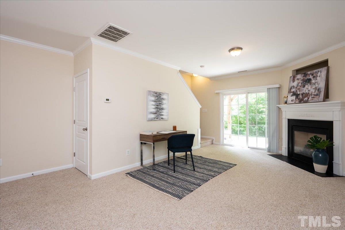 160 Grey Elm Trail Durham, NC 27713 - Photo 22 of 25 a living room with furniture a fireplace and a table