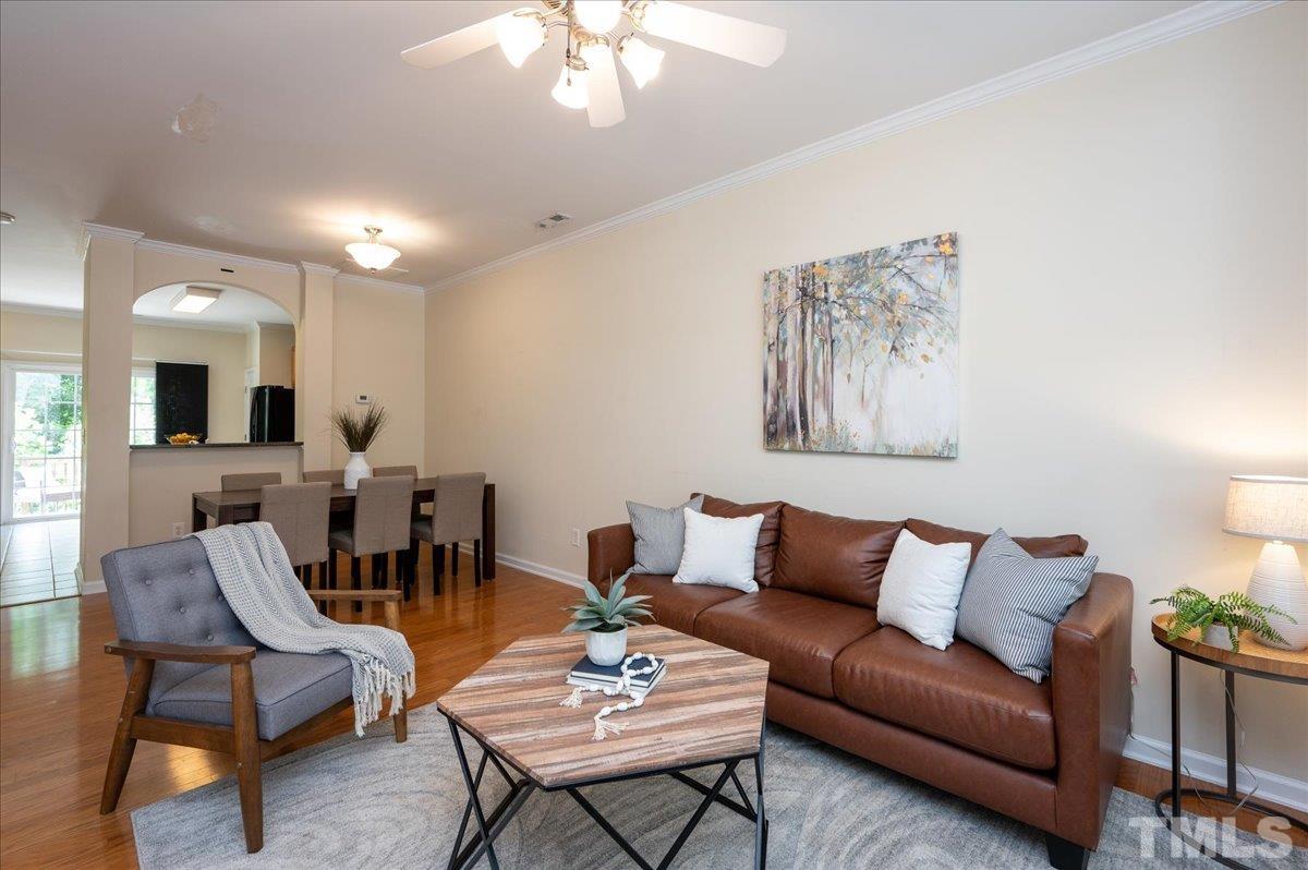 160 Grey Elm Trail Durham, NC 27713 - Photo 3 of 25 a living room with furniture and a chandelier