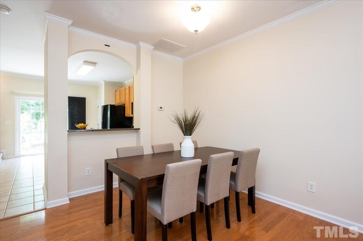160 Grey Elm Trail Durham, NC 27713 - Photo 9 of 25 a view of a dining room with furniture and wooden floor
