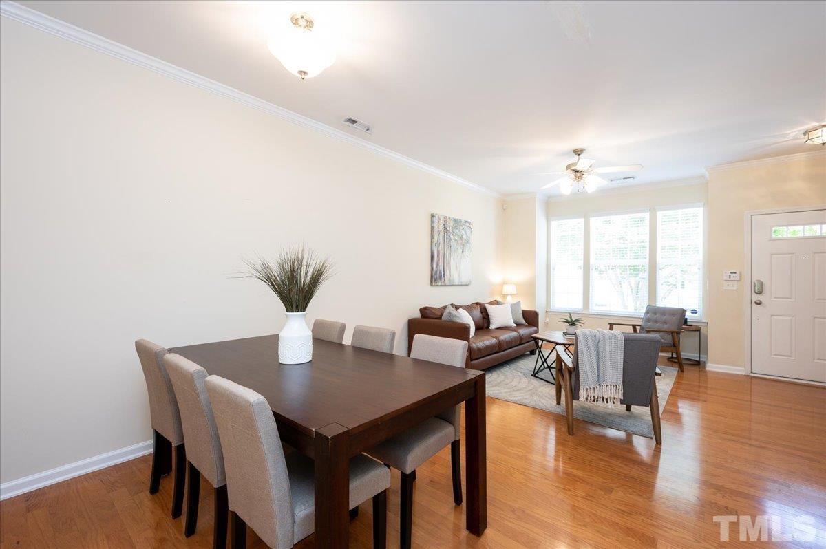 160 Grey Elm Trail Durham, NC 27713 - Photo 10 of 25 a view of a dining room with furniture and wooden floor