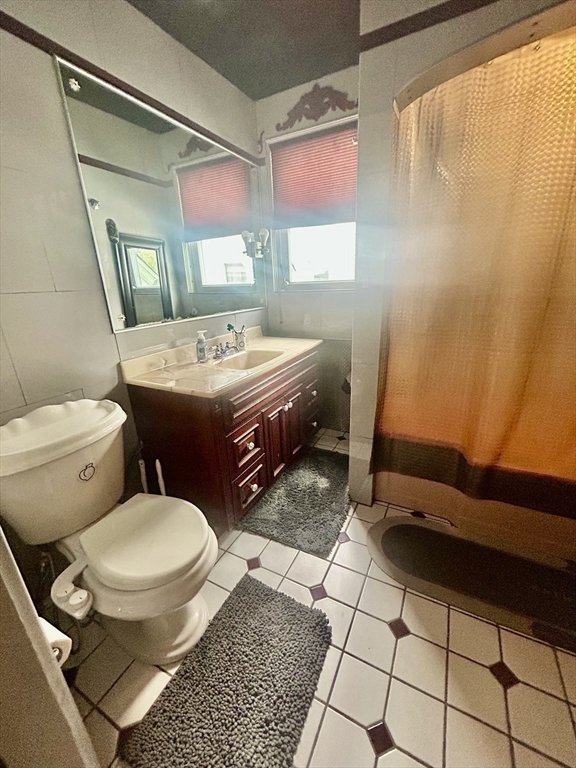 114 Lovell Street Worcester, MA 01603 - Photo 22 of 39 a bathroom with a sink toilet and shower