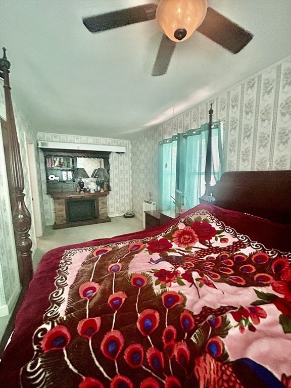 114 Lovell Street Worcester, MA 01603 - Photo 27 of 39 a bedroom with a large bed and a window