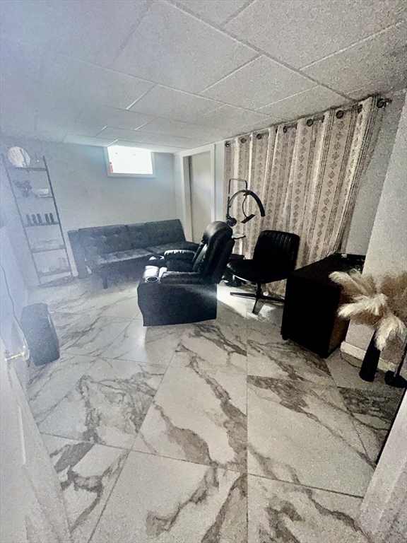 114 Lovell Street Worcester, MA 01603 - Photo 32 of 39 a living room with furniture windows and a rug