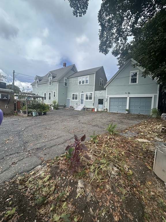 114 Lovell Street Worcester, MA 01603 - Photo 39 of 39 a front view of a house with a yard