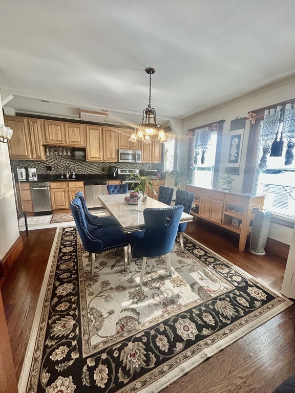 114 Lovell Street Worcester, MA 01603 - Photo 10 of 39 a living room with dining table and a fireplace