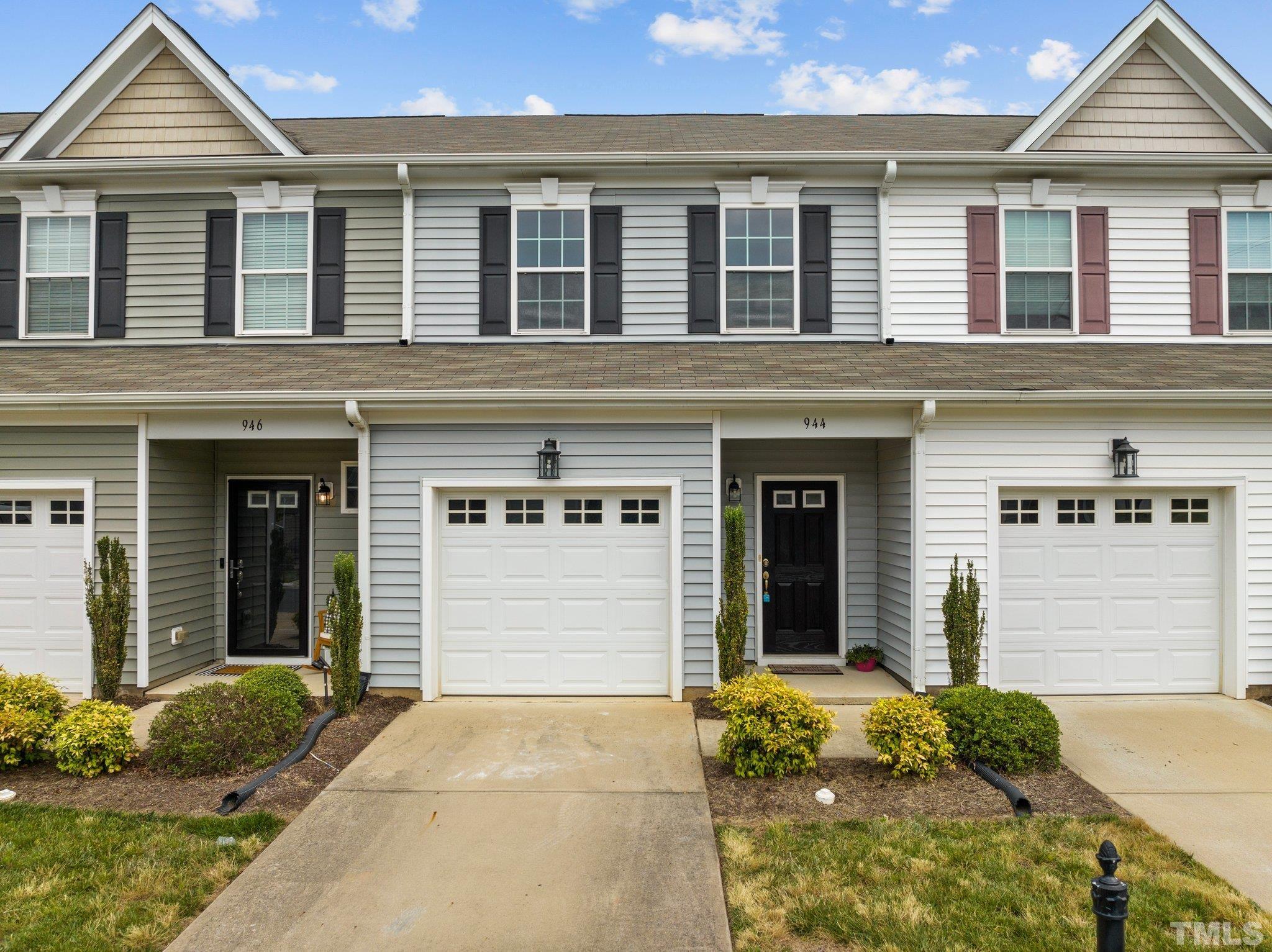 944 Consortium Drive Raleigh, NC 27603 - Photo 1 of 30 front view of a brick house with a large windows