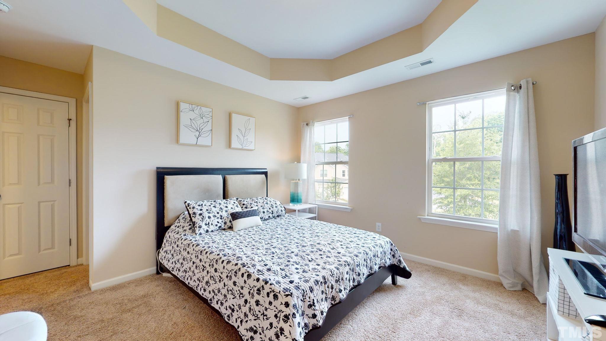 944 Consortium Drive Raleigh, NC 27603 - Photo 19 of 30 a bedroom with a bed table and window