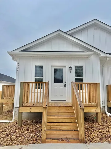 a view of entryway with wooden floor