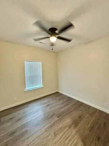 a view of storage and utility room with racks on the wall