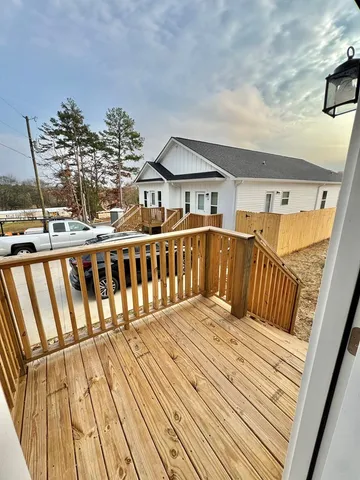 a view of balcony with wooden floor