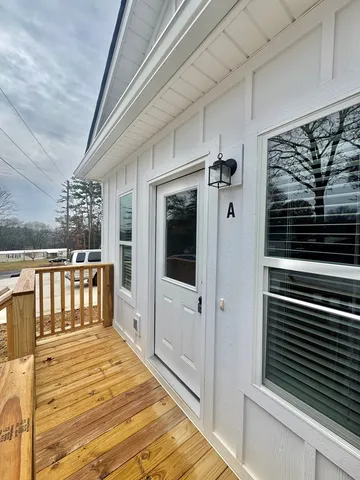 a view of balcony and wooden floor