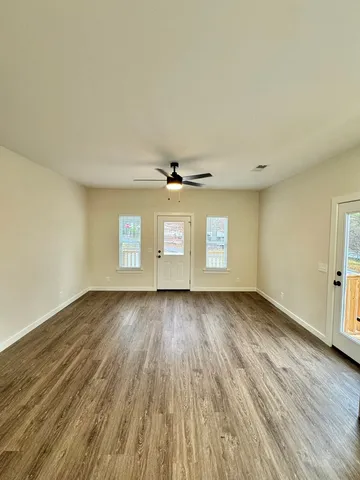 a view of a kitchen with a sink and a stove top oven