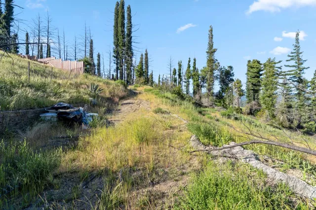 a view of a lake with a house in background