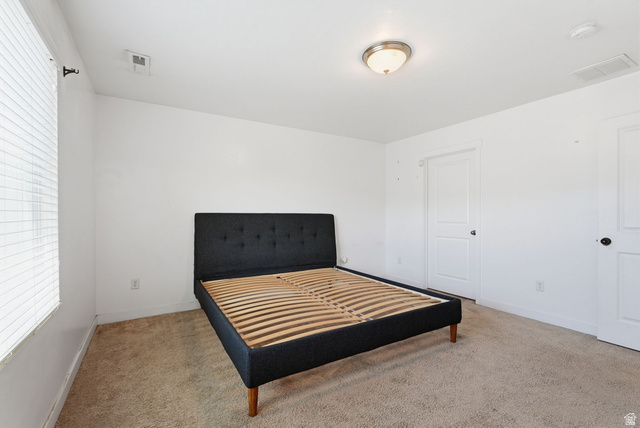 14764 Rising Star Way Riverton, UT 84065 - Photo 17 of 42 Carpeted flooring, white interior doors with black hardware, and a ceiling-mounted light fixture