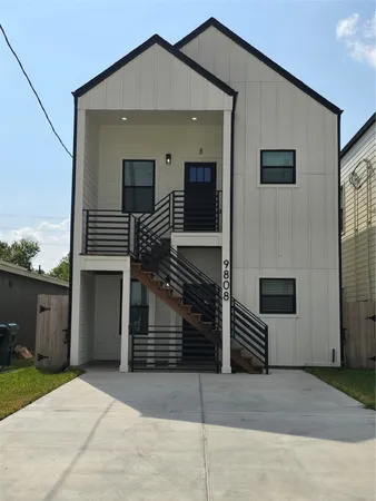a front view of a house with garage