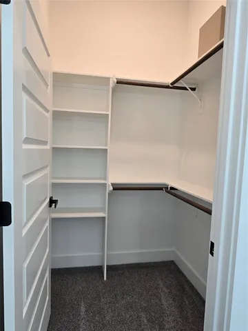 a view of an empty walk in closet