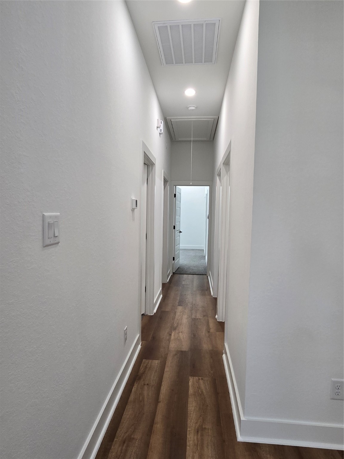 9808 Pelsey Street, Unit B Houston, TX 77029 - Photo 4 of 17 a view of a hallway with wooden floor