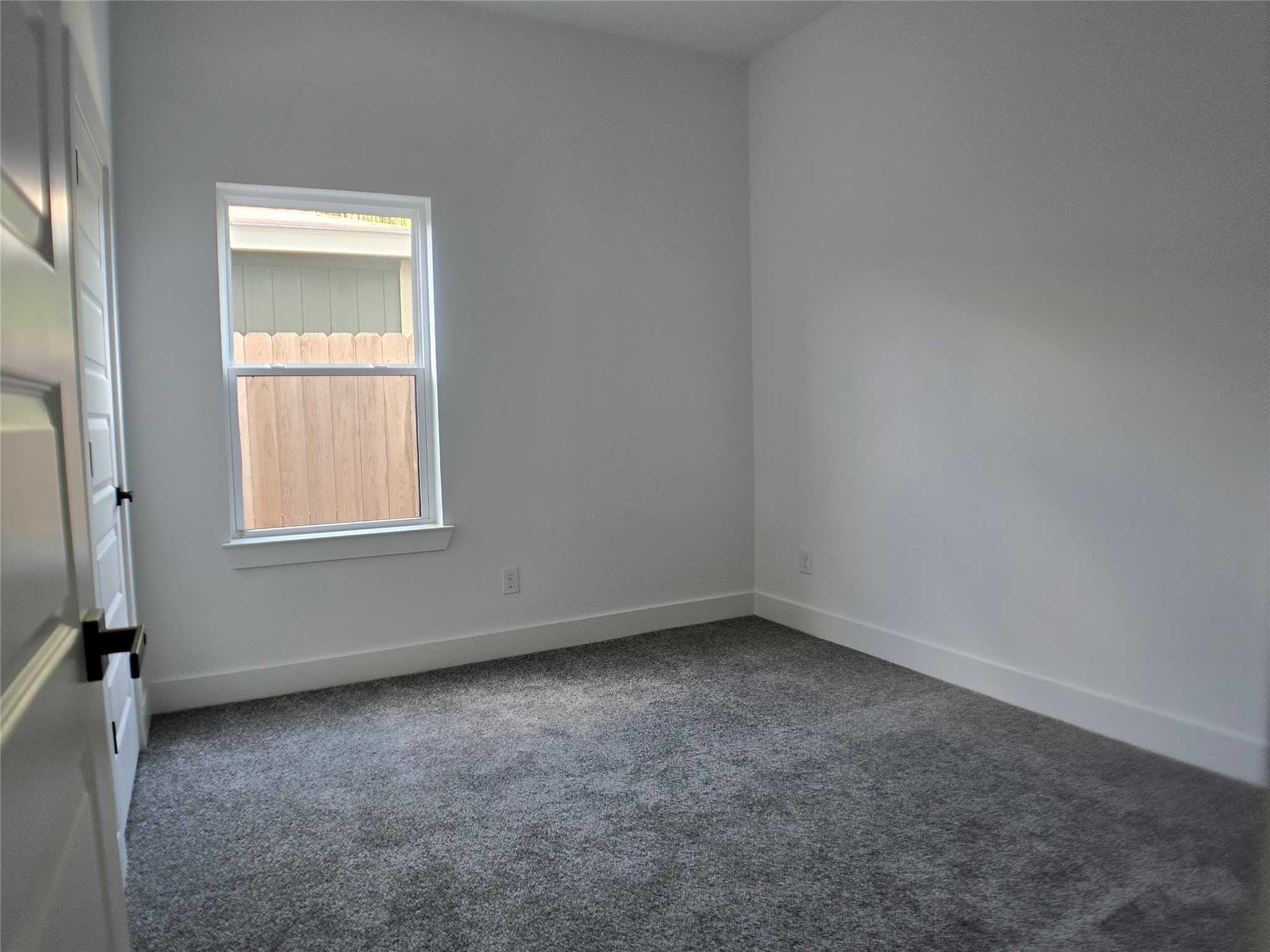 9808 Pelsey Street, Unit B Houston, TX 77029 - Photo 6 of 17 an empty room with a window