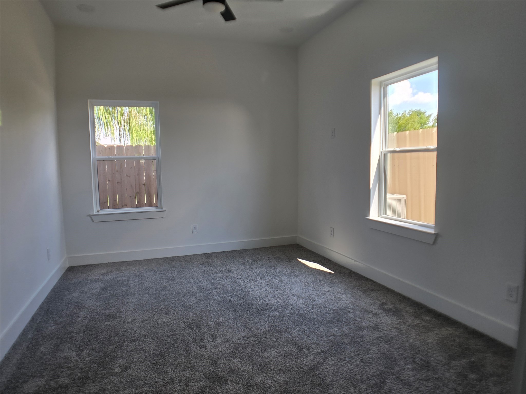 9808 Pelsey Street, Unit B Houston, TX 77029 - Photo 8 of 17 an empty room with windows