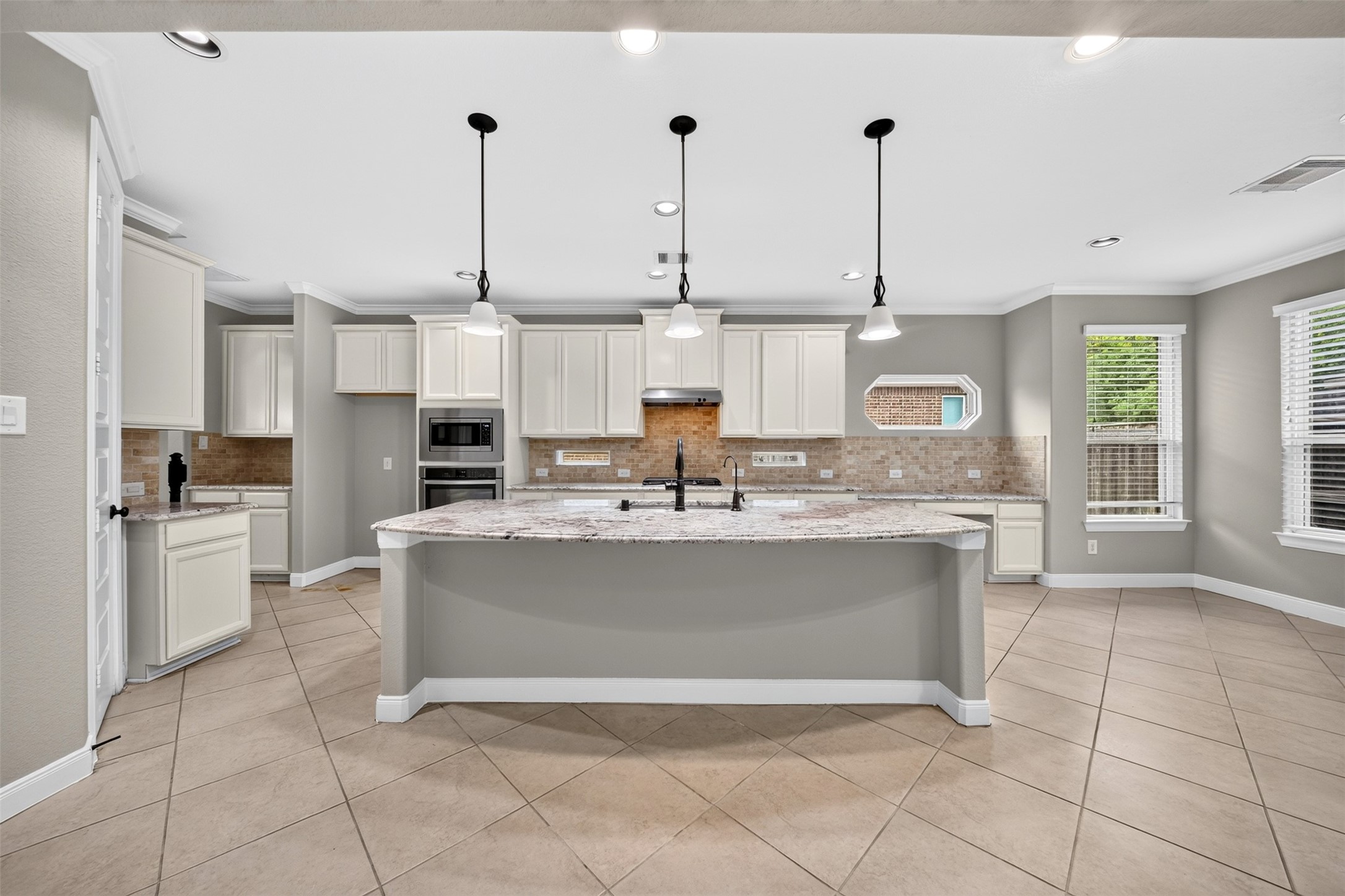 6234 Avon Landing Lane Spring, TX 77379 - Photo 16 of 49 The kitchen that keeps you organized! Offering ample cabinetry for storage, countertop space and double ovens, this layout features a dedicated built-in workstation.