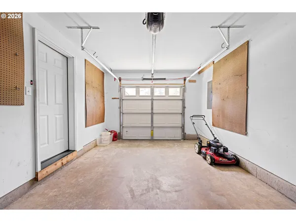 a view of a room with gym equipment and a window