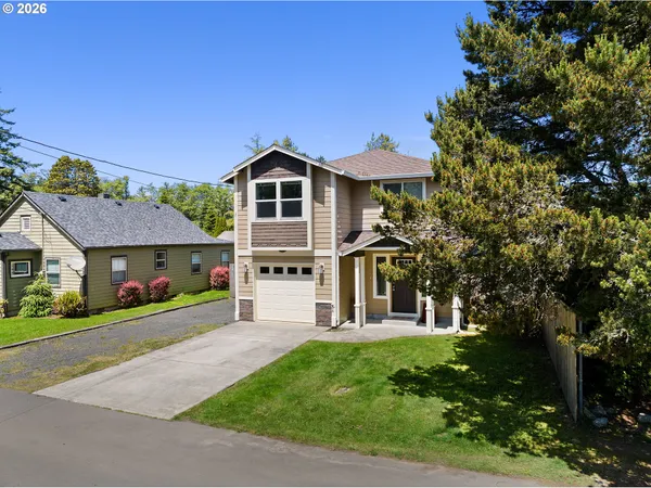 a front view of a house with a yard