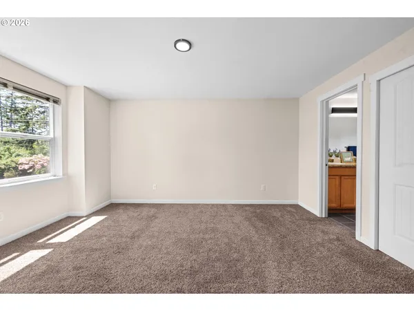 a view of an empty room with a window