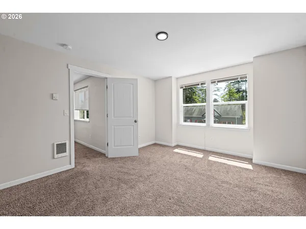 a view of an empty room with a window