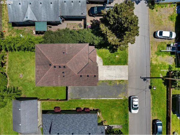 an aerial view of a house with a yard