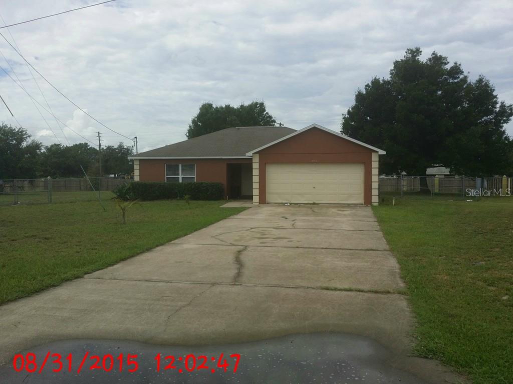 106 Weeping Willow Road Eagle Lake, FL 33839 - Photo 1 of 1 a front view of a house with garden
