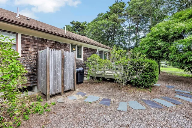 a view of a house with a backyard