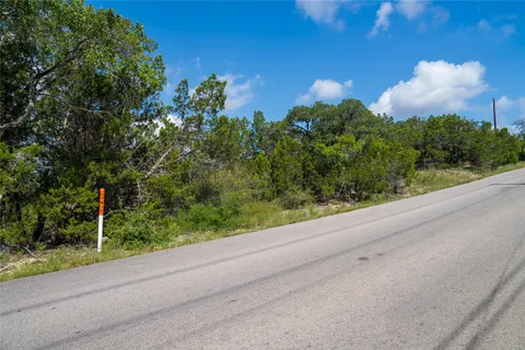a view of a pathway both side of yard