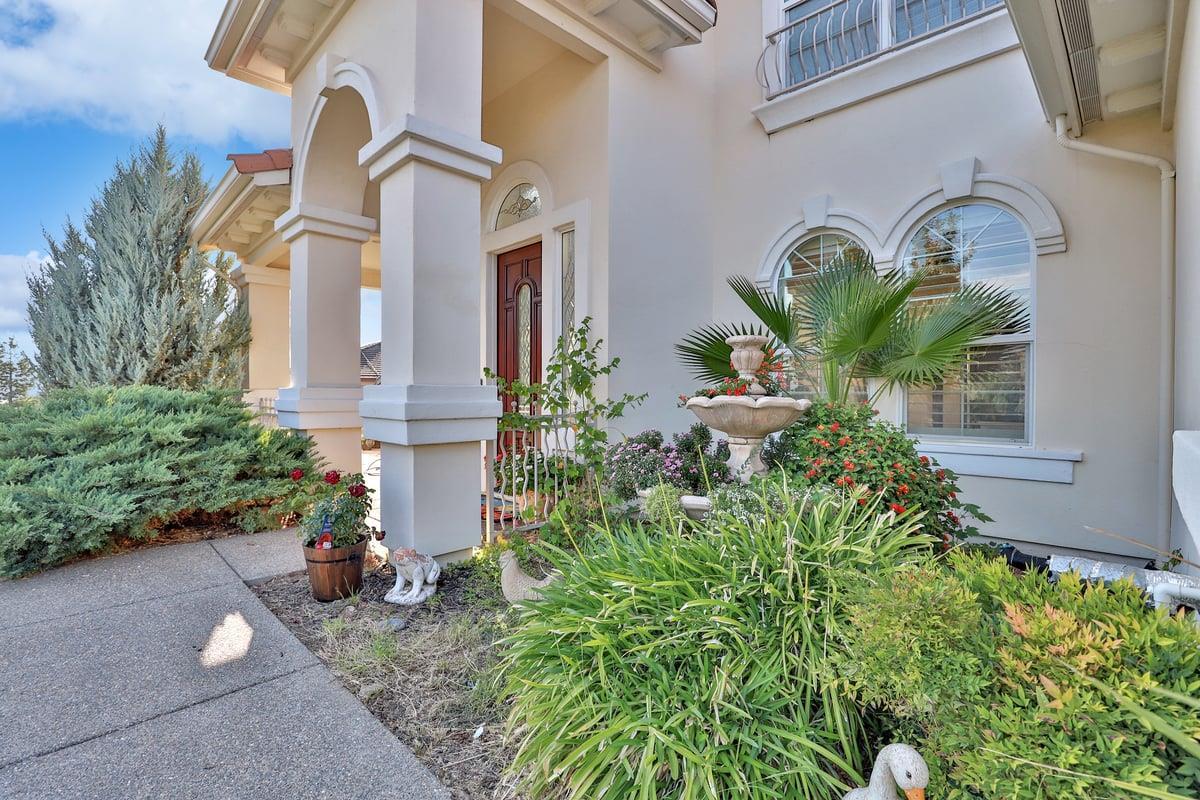 5100 Thalia Drive El Dorado Hills, CA 95762 - Photo 22 of 60 a front view of a house with garden