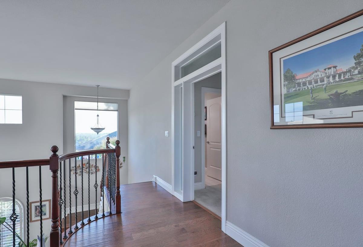 5100 Thalia Drive El Dorado Hills, CA 95762 - Photo 34 of 60 a view of a hallway with wooden floor and a bedroom