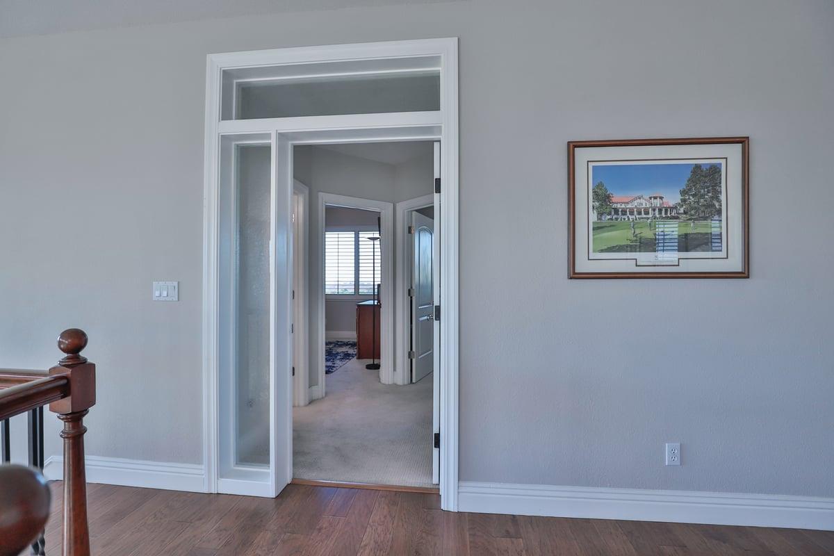 5100 Thalia Drive El Dorado Hills, CA 95762 - Photo 36 of 60 a view of a hallway with wooden floor and a livingroom