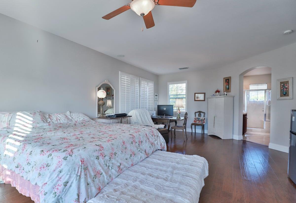 5100 Thalia Drive El Dorado Hills, CA 95762 - Photo 45 of 60 a bedroom with bed and a chandelier