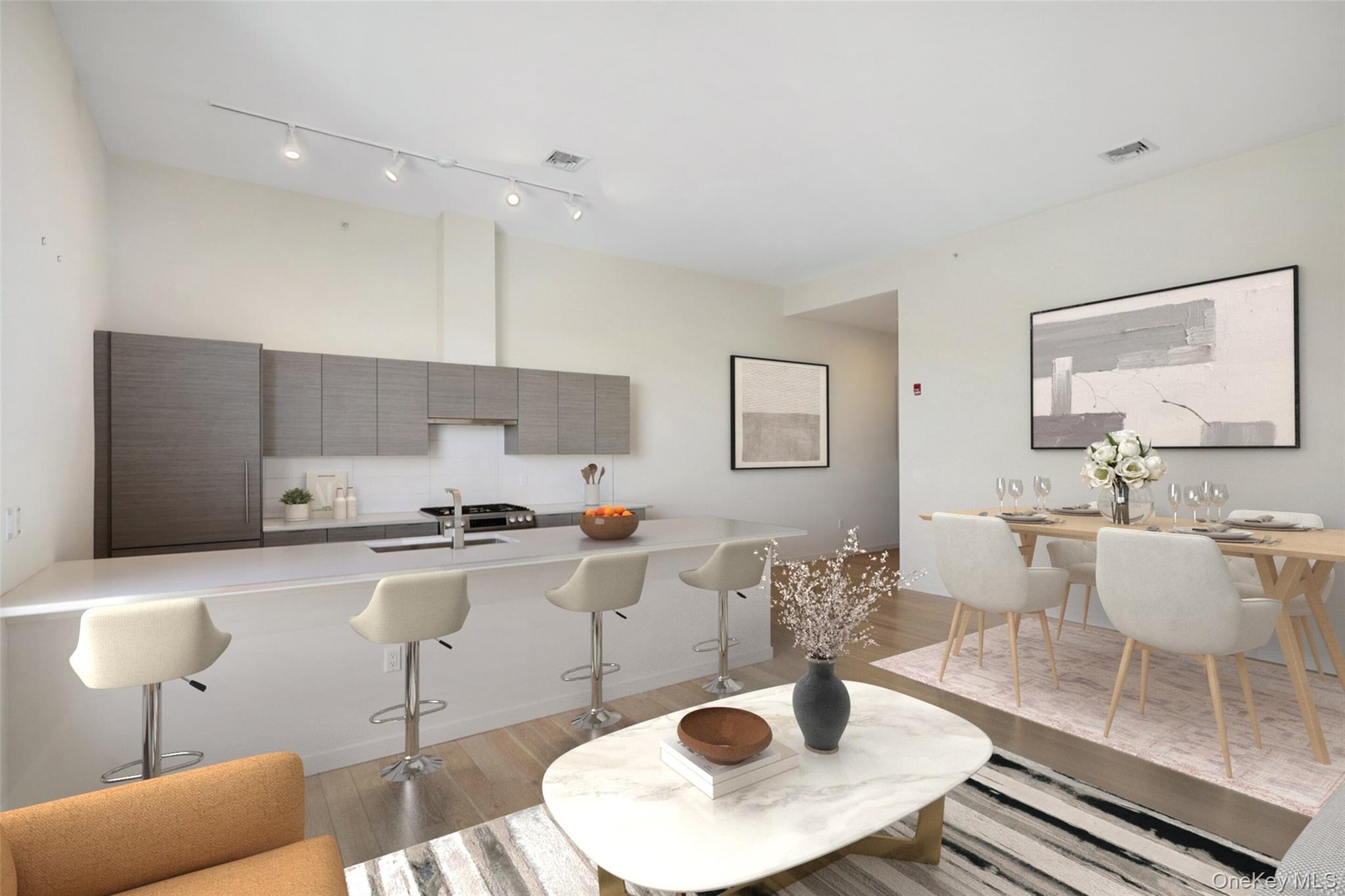 2 2nd Street, Unit 26 Rye, NY 10580 - Photo 2 of 8 a kitchen with stainless steel appliances granite countertop a stove a sink a dining table and chairs